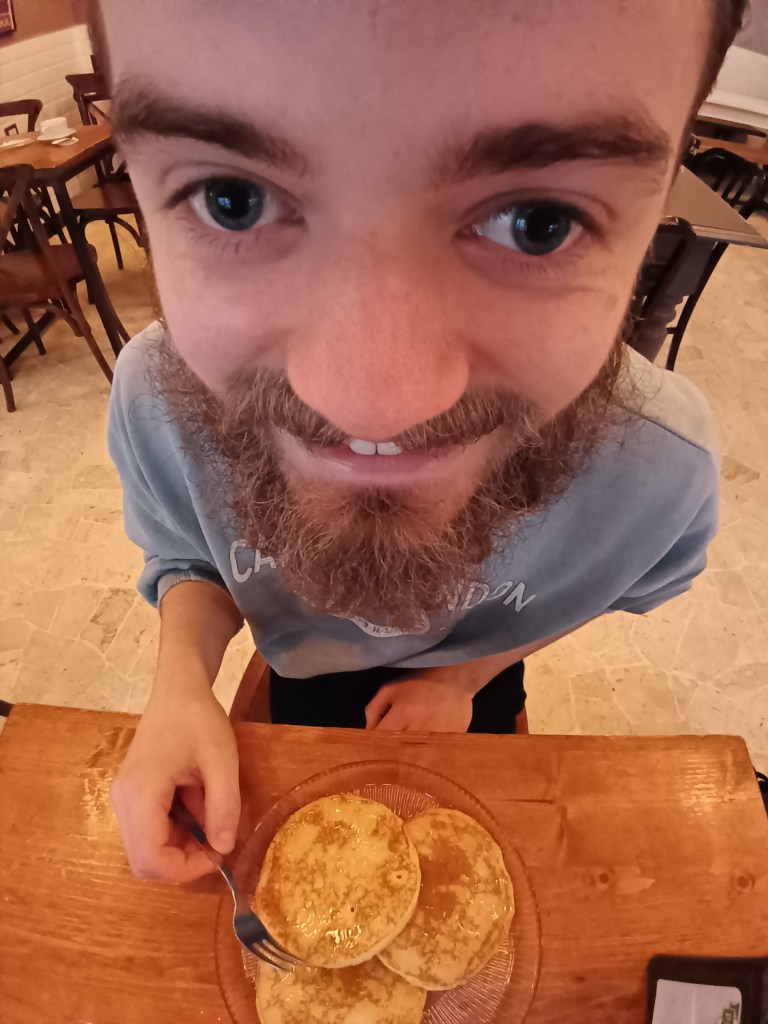 A close up picture of Kit with his birthday pancakes