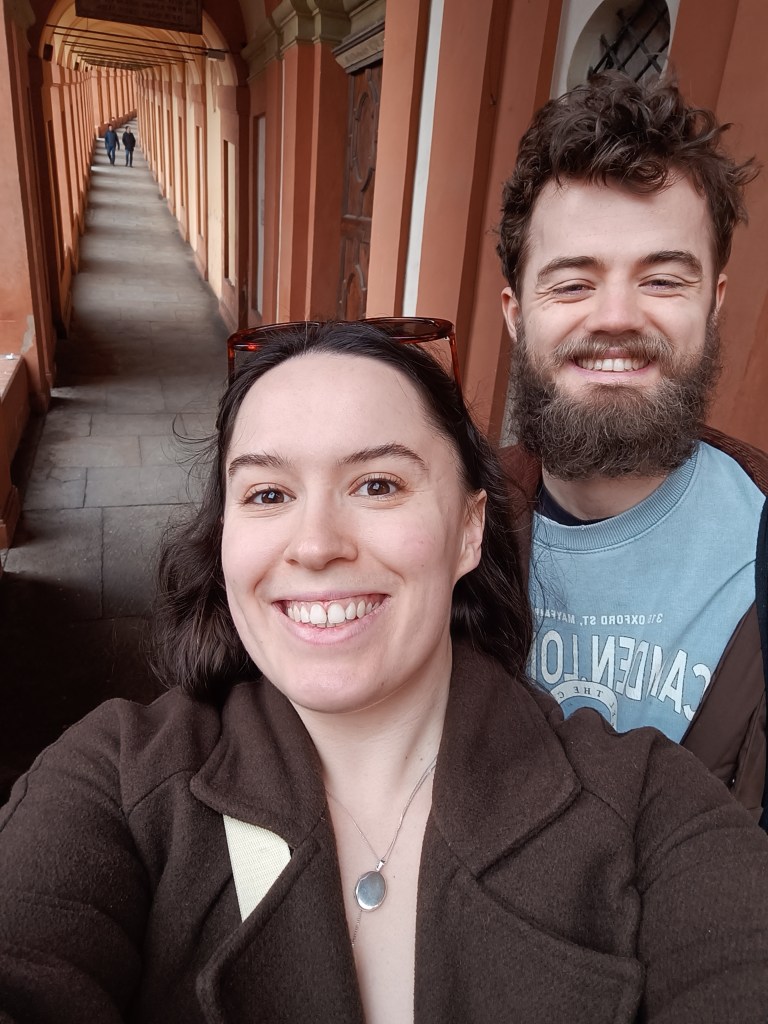 Kit and I smile for a selfie in the porticos