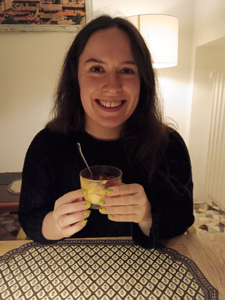 I smile holding our home made tiramisu