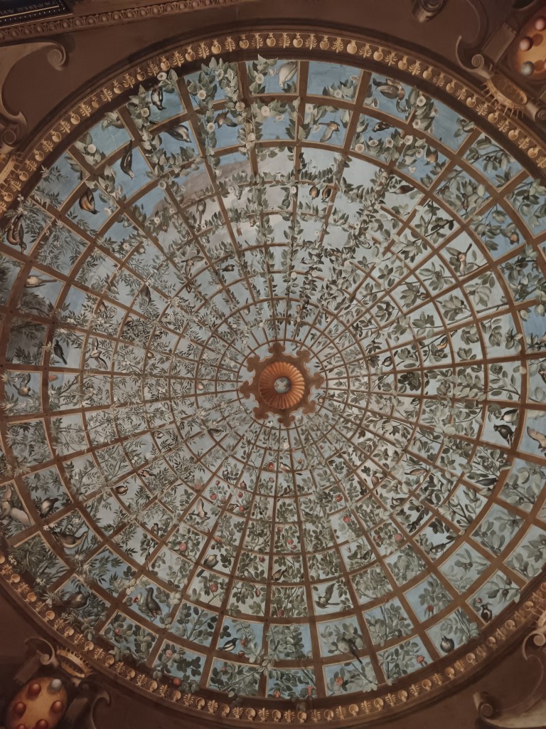 A floral painted domed ceiling