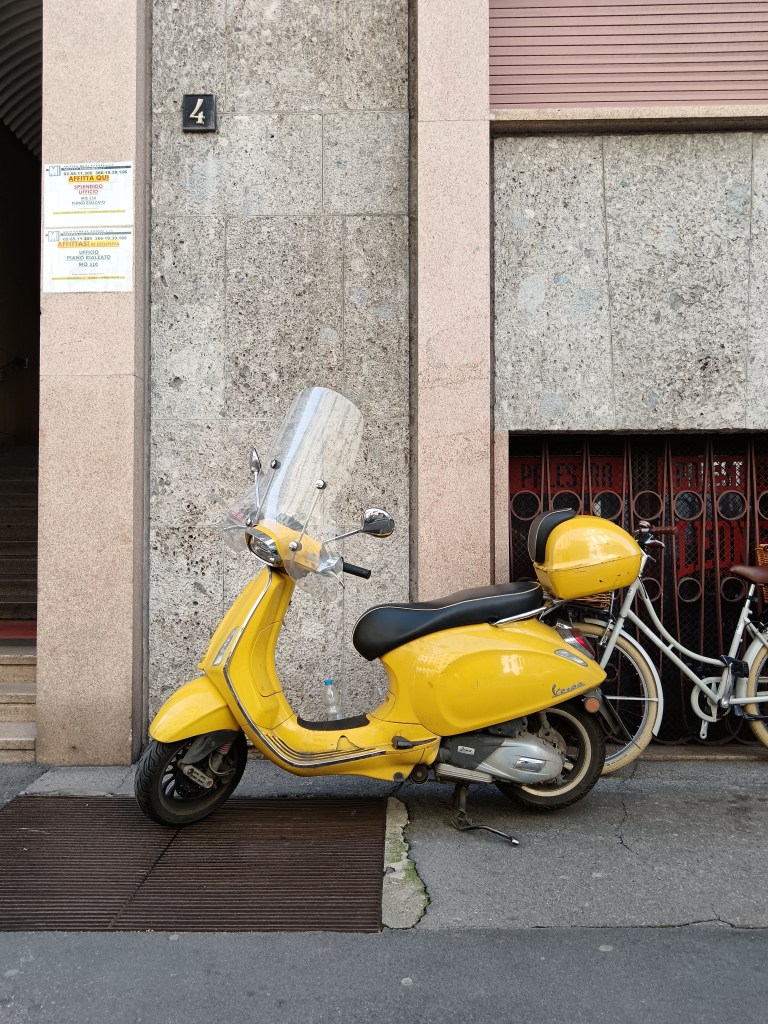 A cute yellow Vespa