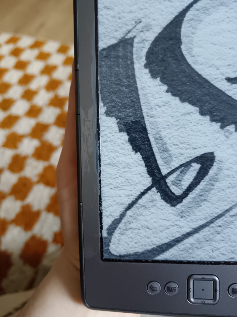 The side of my Kindle all scuffed up with age