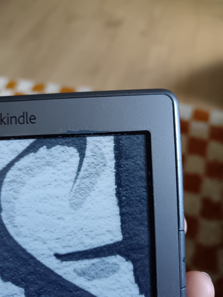 The side of my Kindle all scuffed up with age