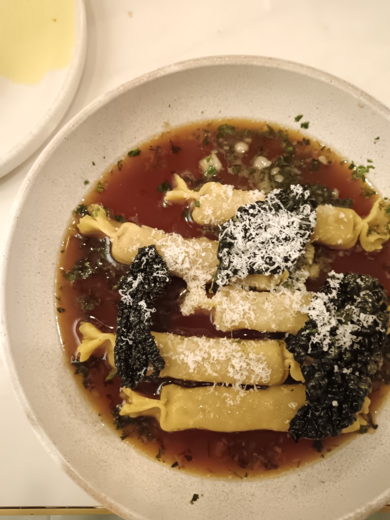 My caramelle pasta in a gravy like broth
