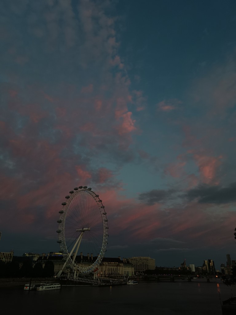 Pink clouds frame the London Eye