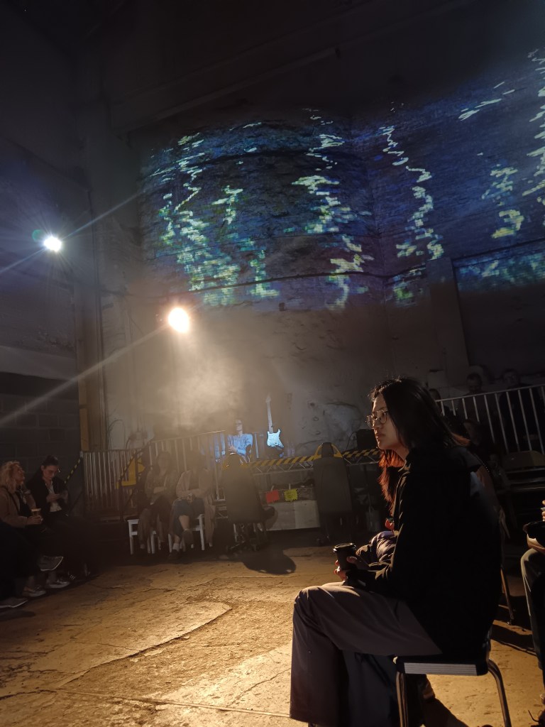 Water is projected on the wall of a warehouse
